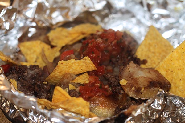 In the end, she caved in and added salsa and corn crisps.