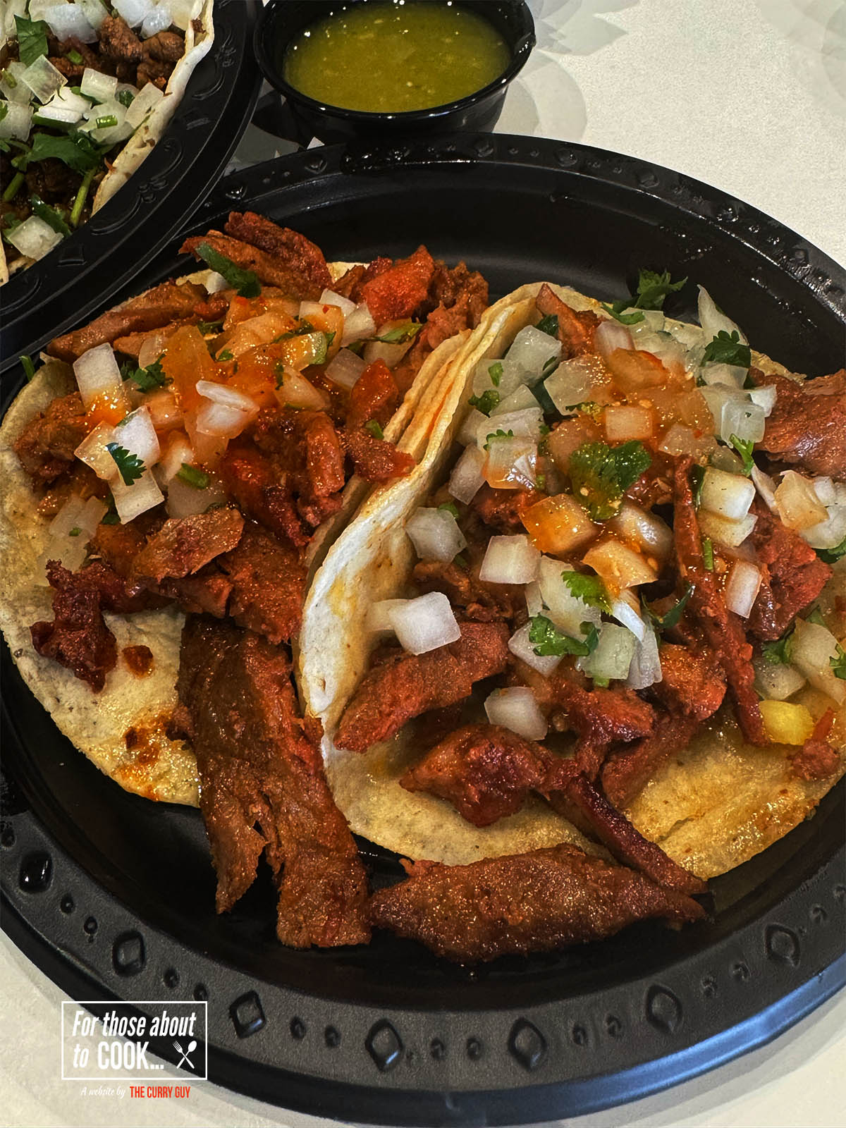 Tacos al pastor on a serving plate