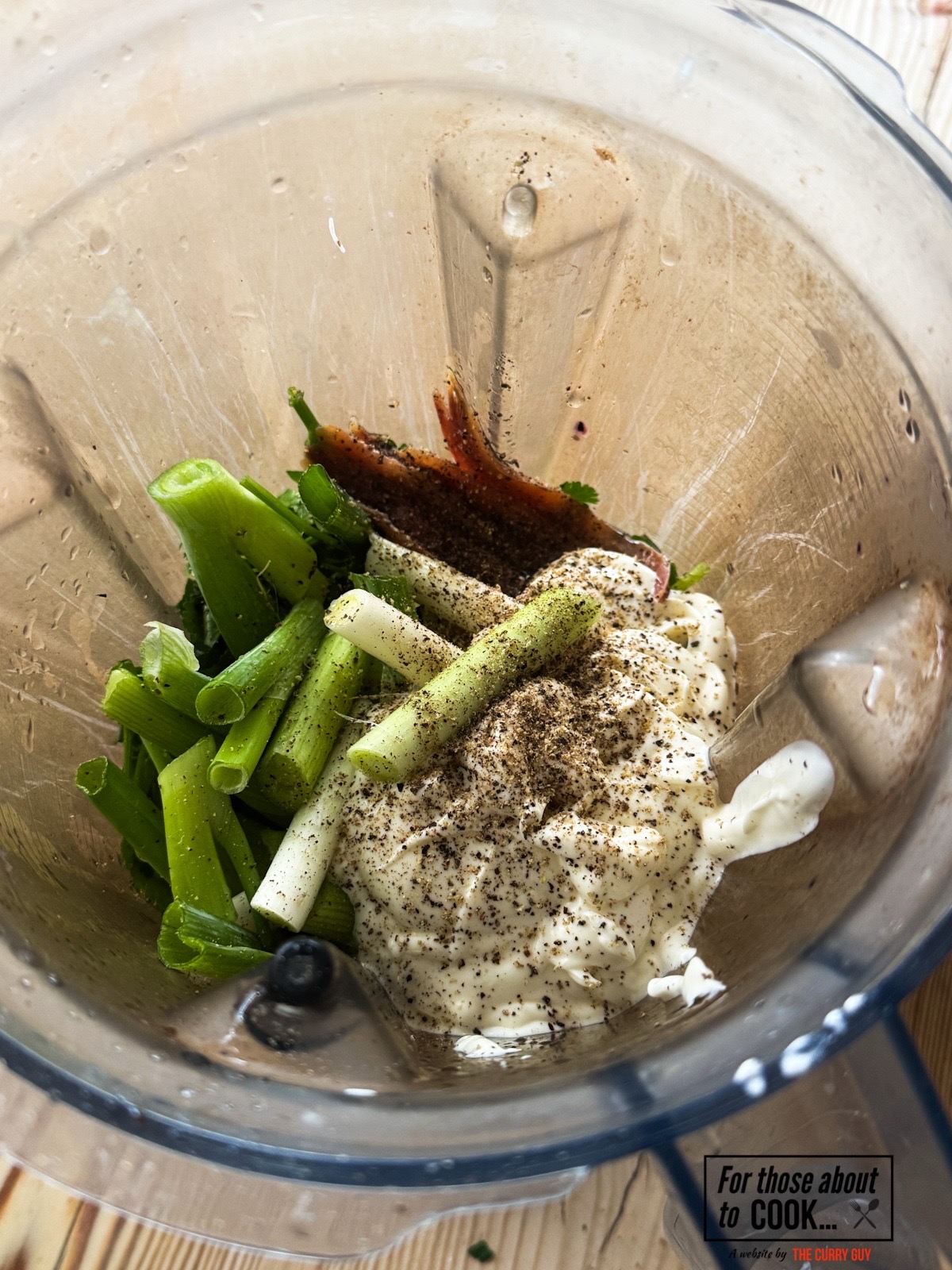 All of the ingredients in a blender ready to blend.