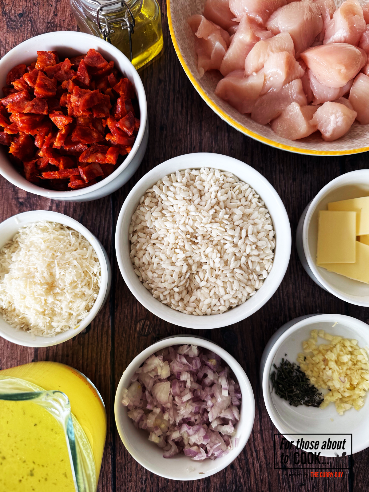 Ingredients for chicken and chorizo risotto separated into bowls