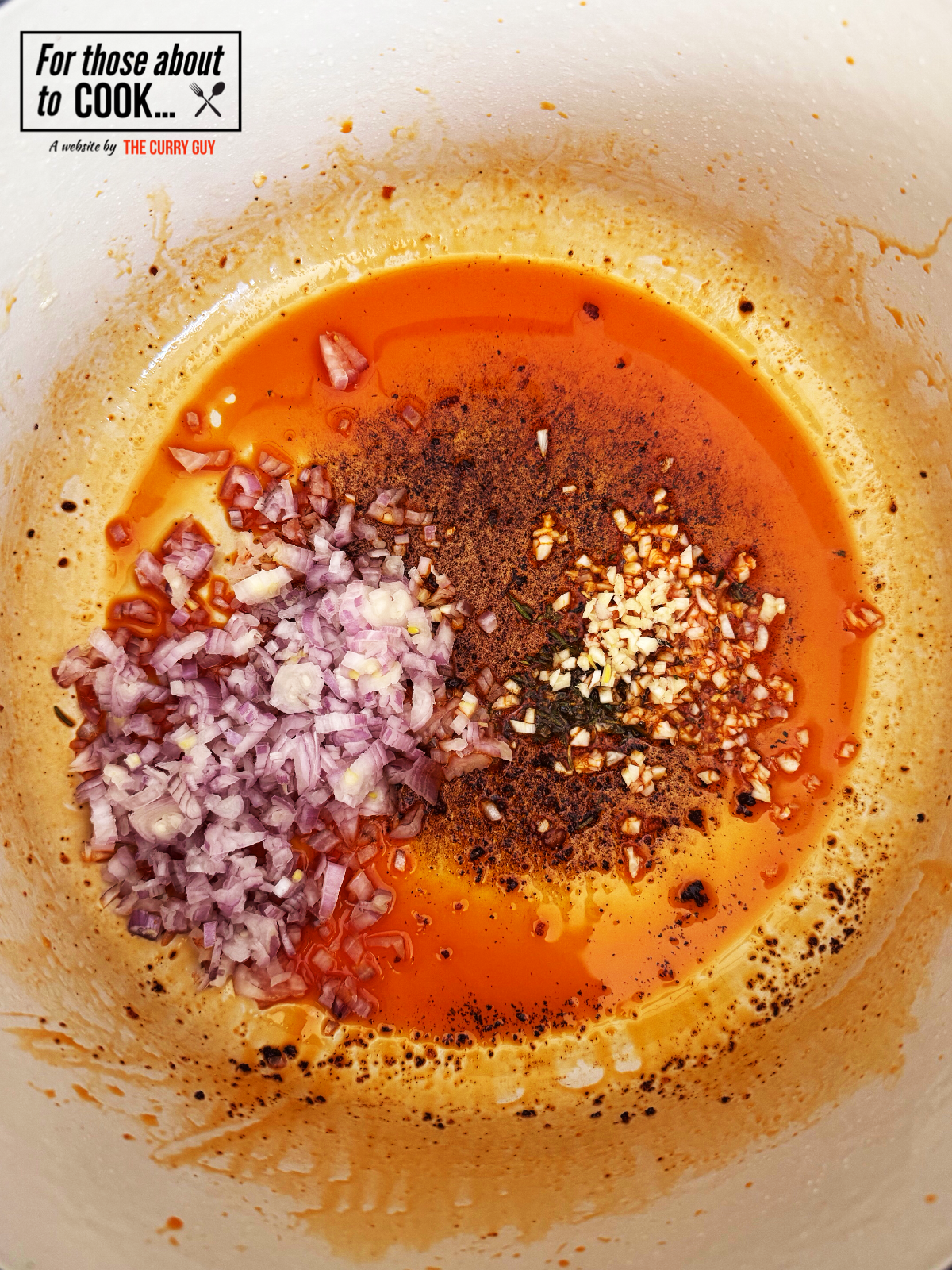 Pot with onion and garlic added to chorizo oil