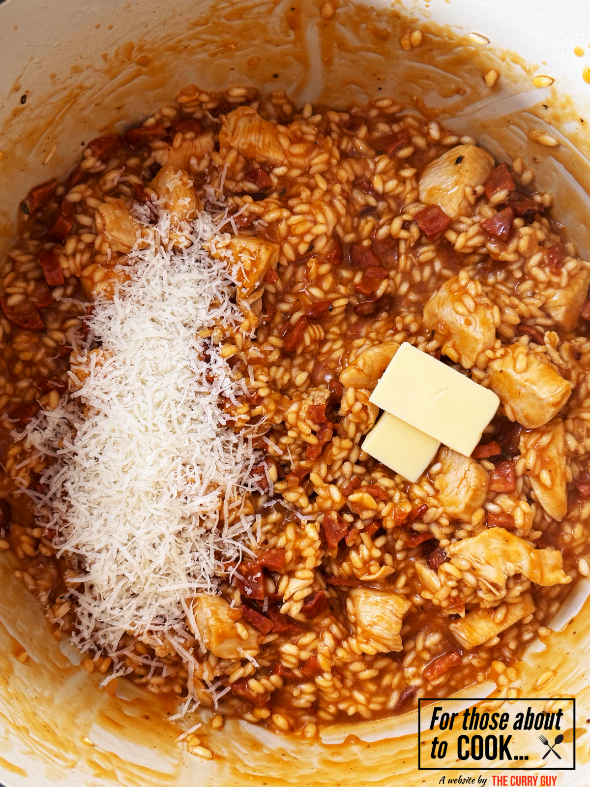 Parmesan and butter added to chicken and chorizo risotto