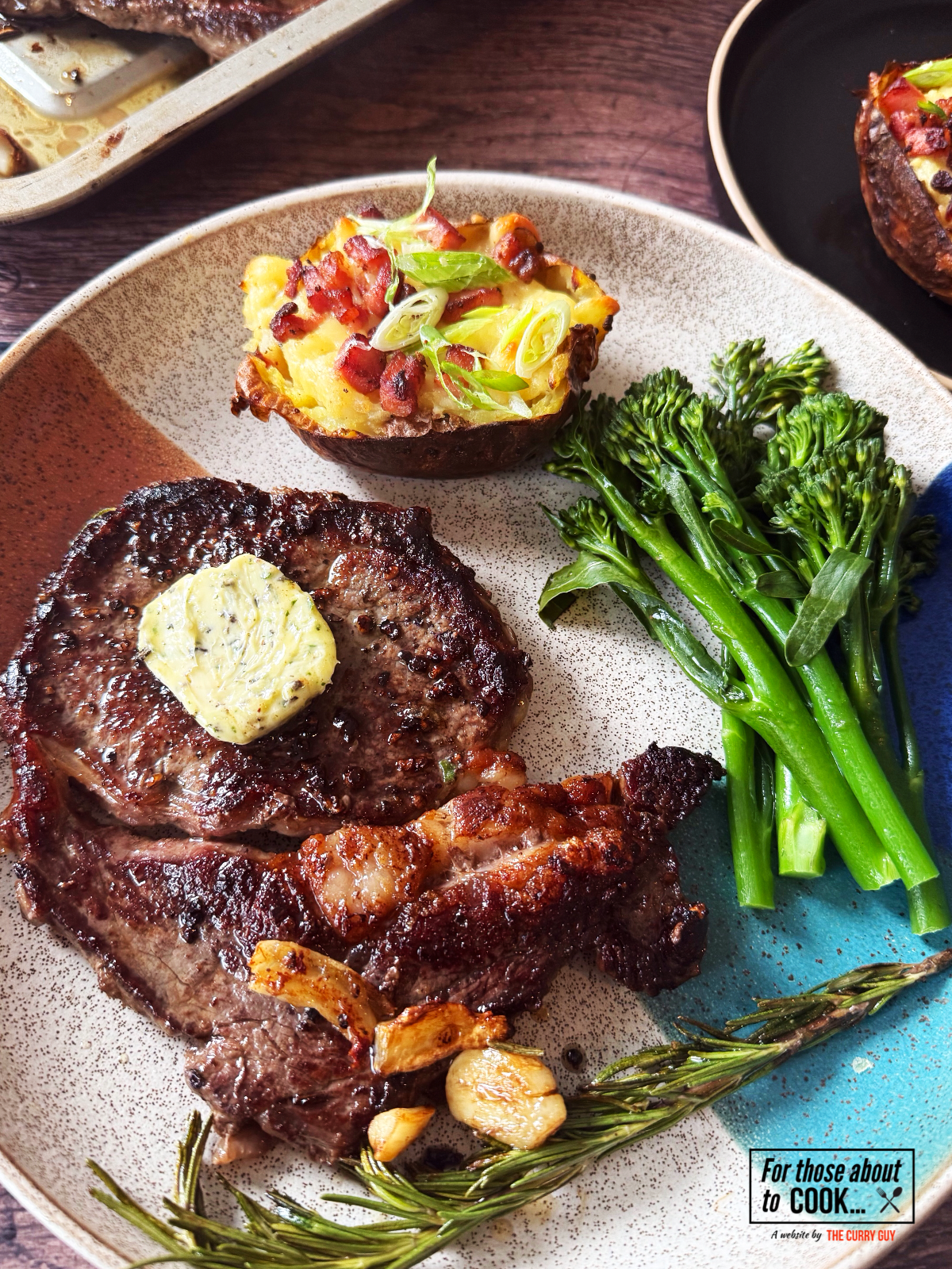 Ribeye steak with garlic butter served with loaded potato and broccoli