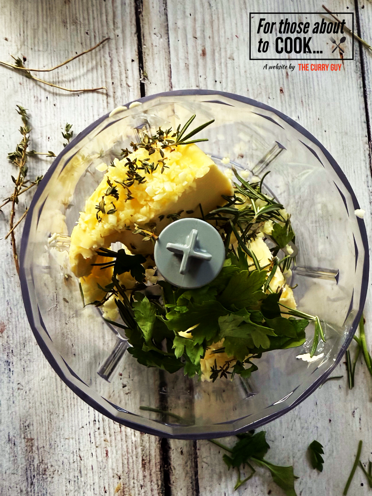 Ingredients for compound garlic butter in a food processor