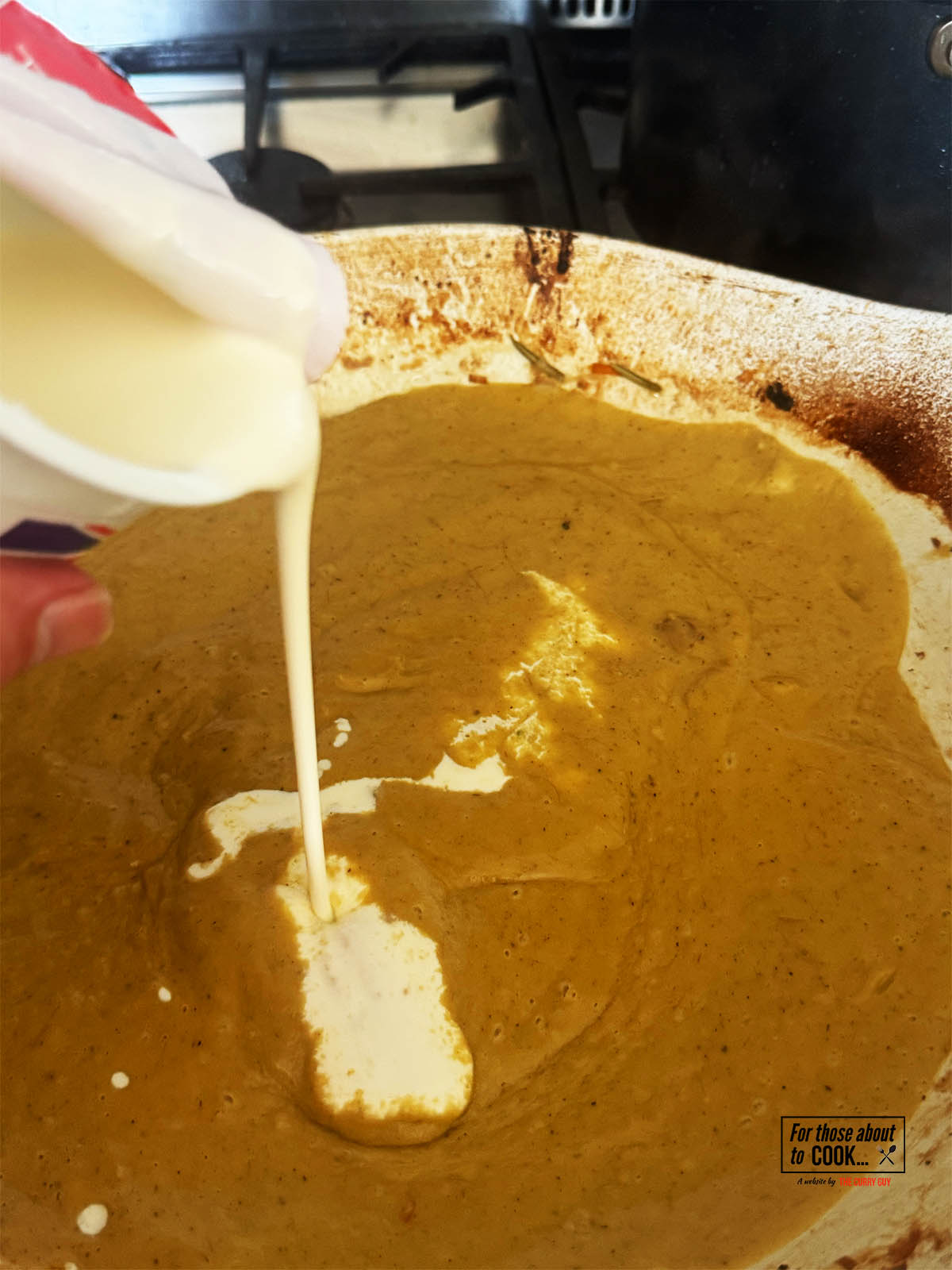 Returning the sauce to the pan and seasoning with salt and pepper to taste.