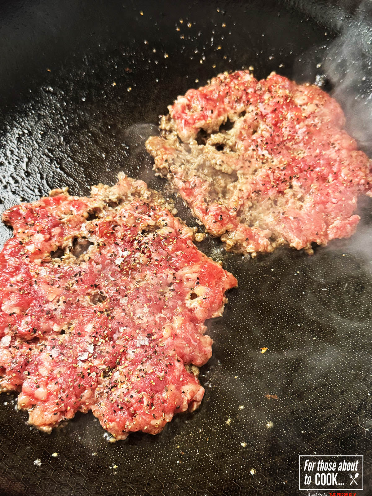 burger patties smashed in a pan and cooking