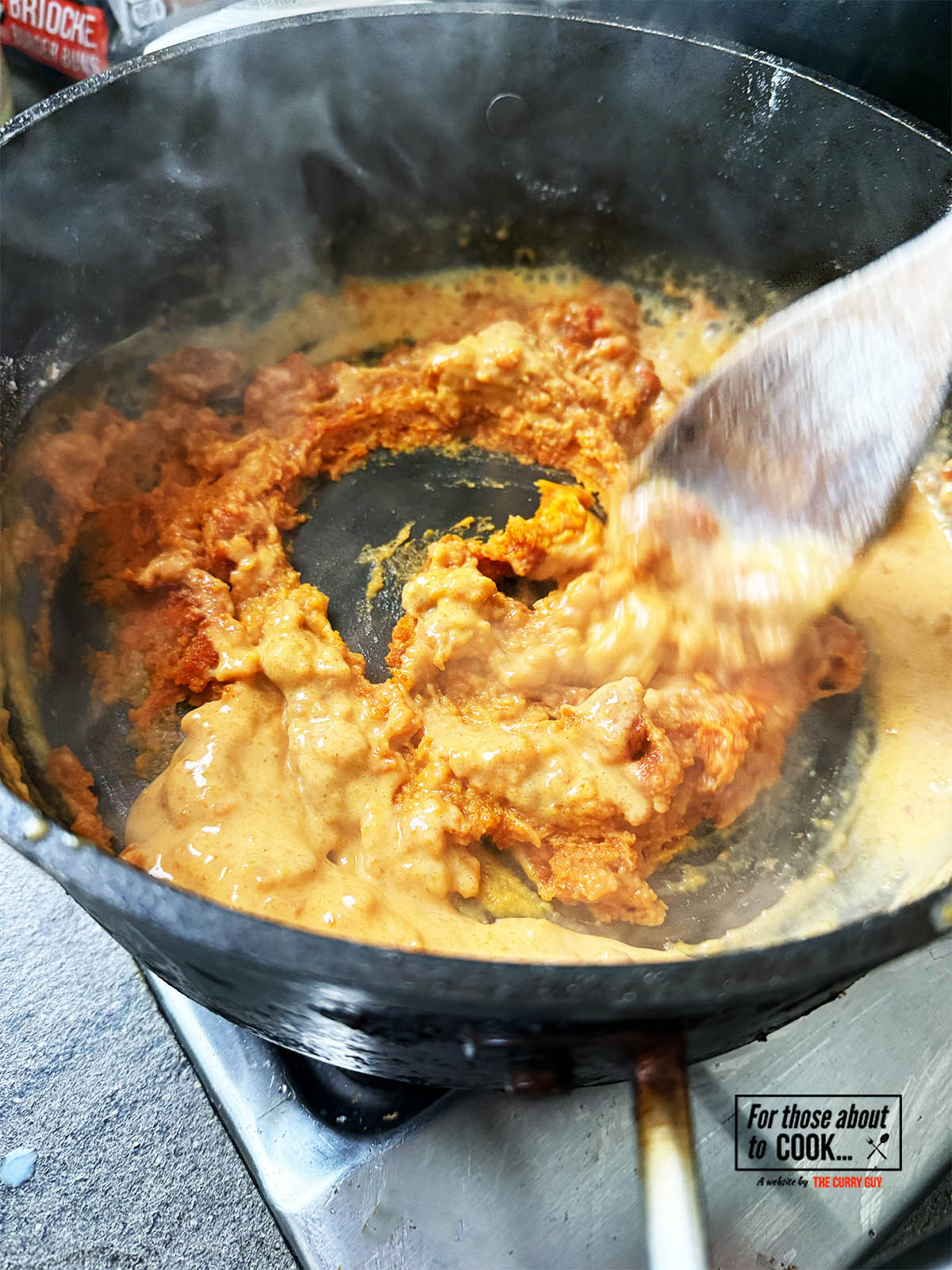 Gradually adding the milk