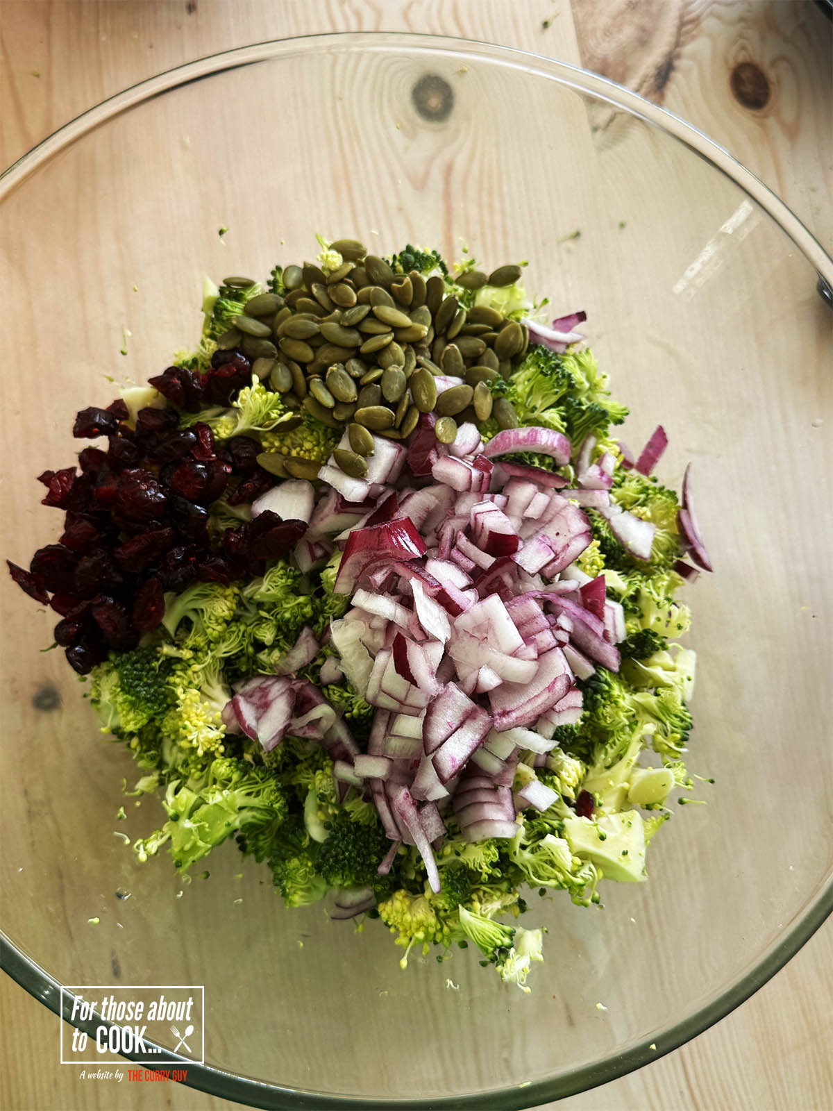 Pouring all the chopped vegetables into a salad bowl.