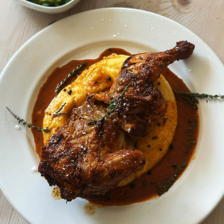 Chicken Diavolo on a bed of polenta with gravy.