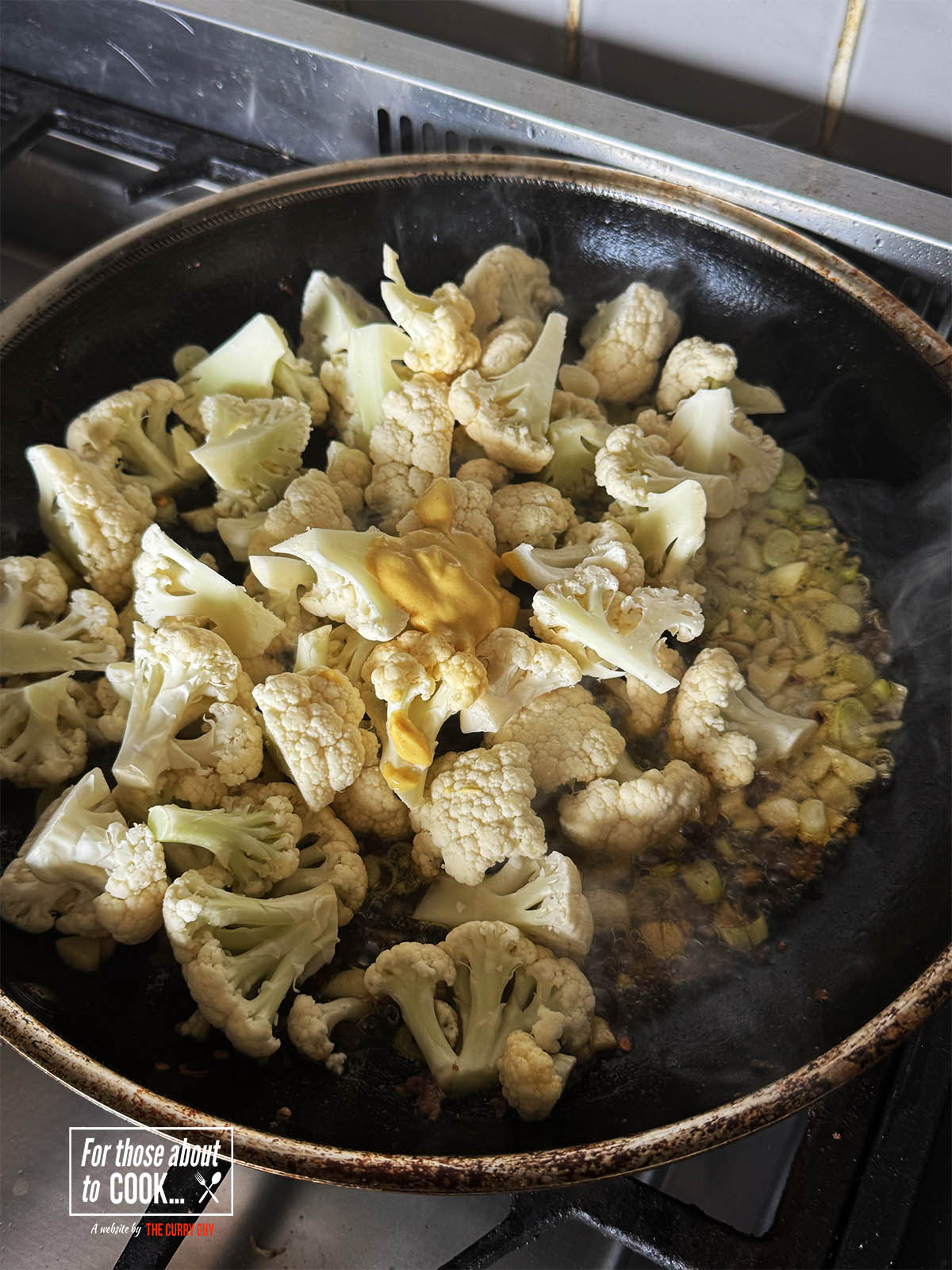Adding the cauliflower and Dijon mustard.