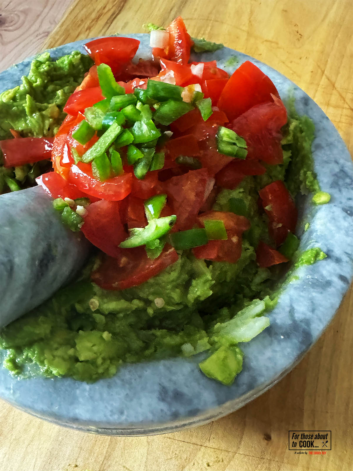 Adding the diced tomatoes and chillies.