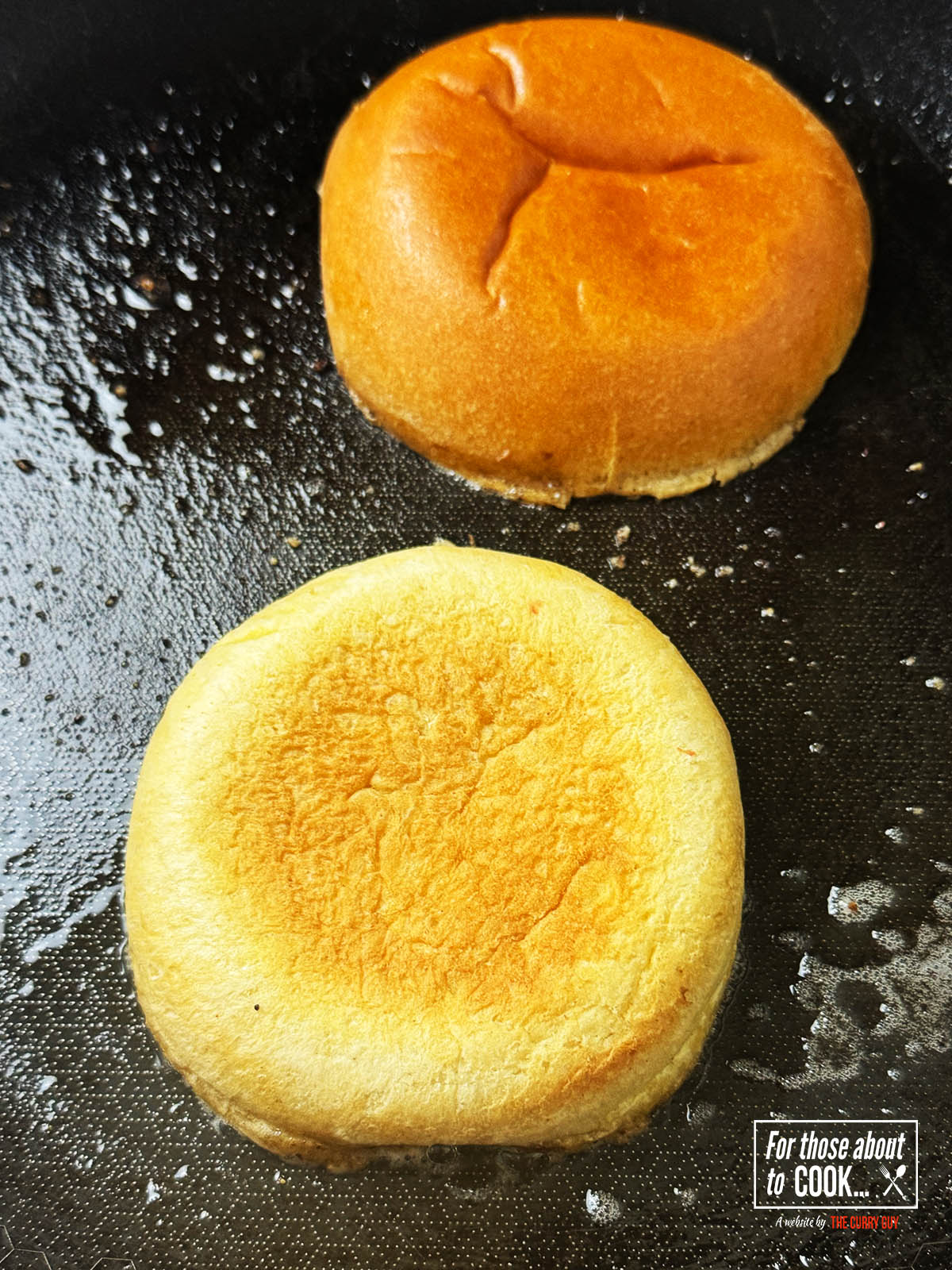 Buns toasting in a pan with butter