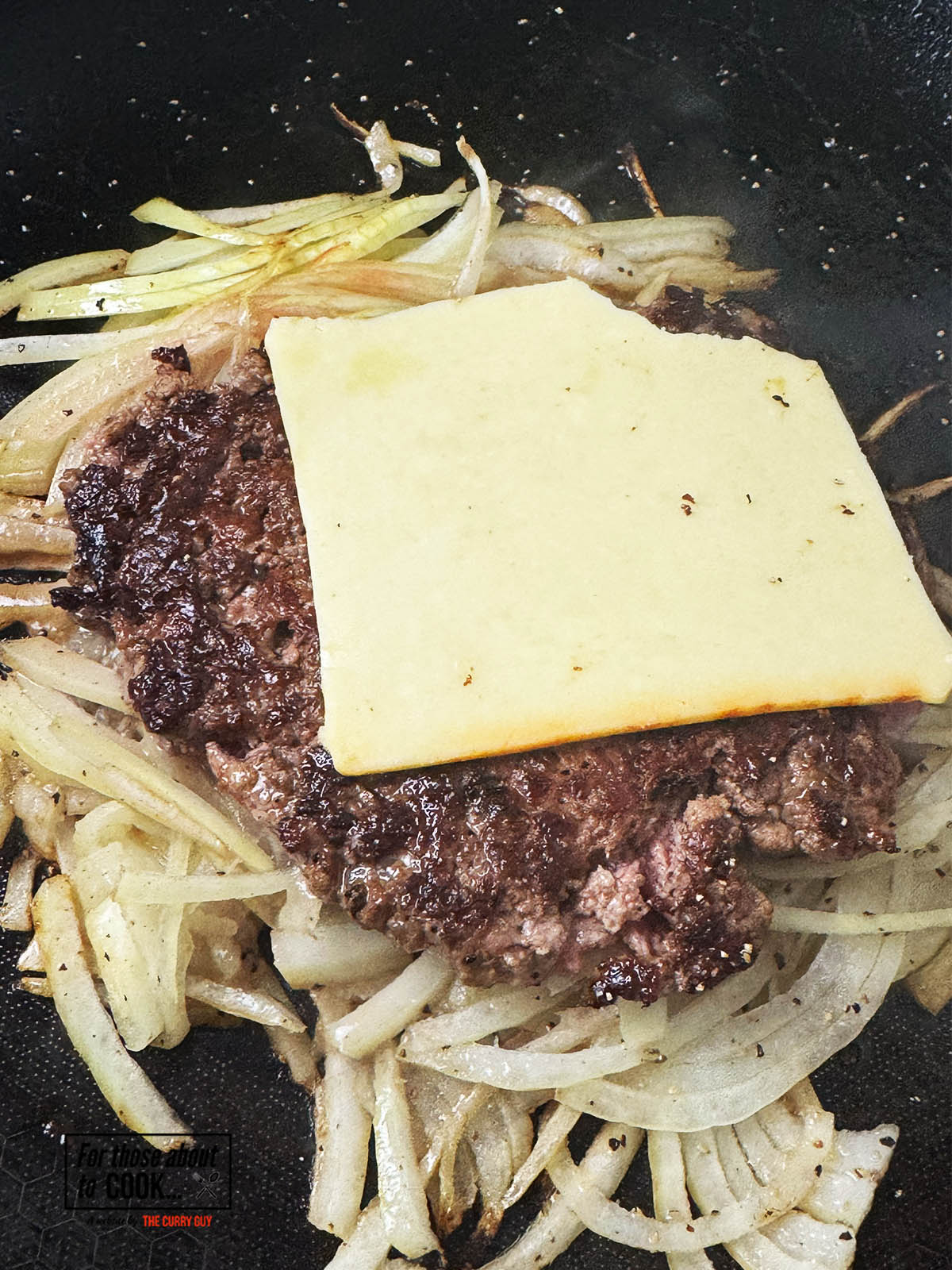 Cheese slice added to Oklahoma burger