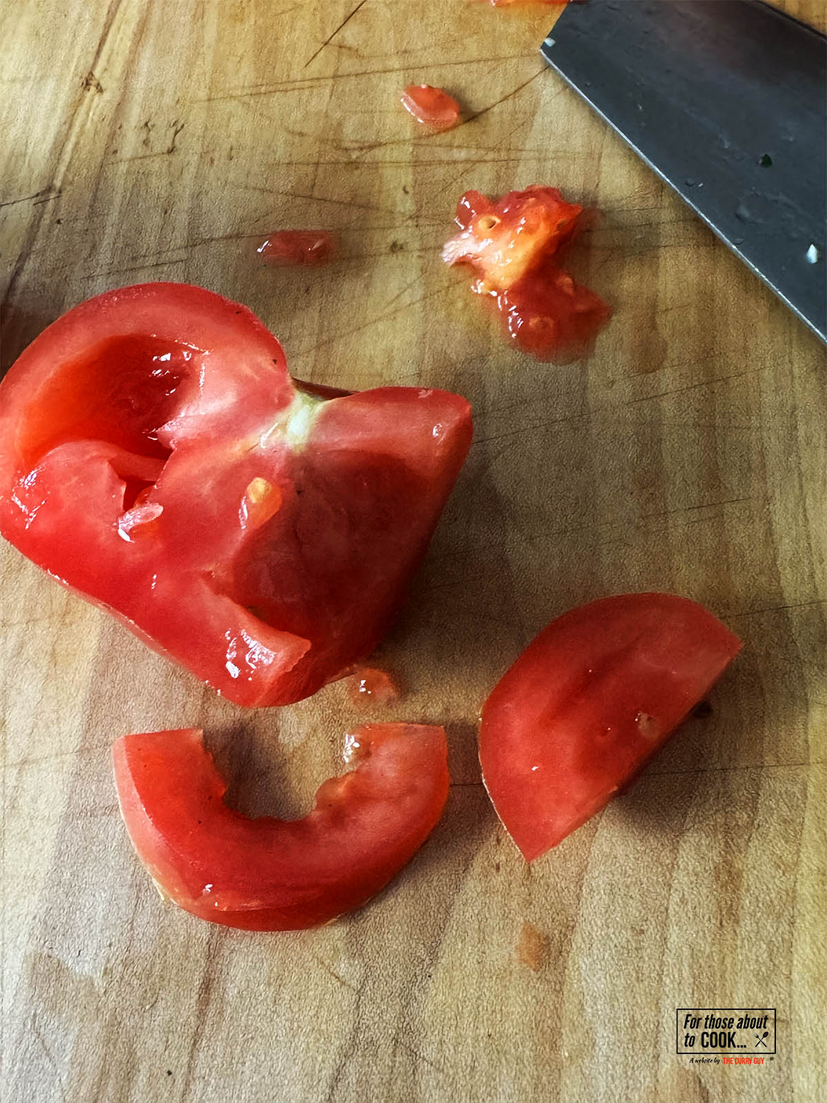 Chopping the tomato.