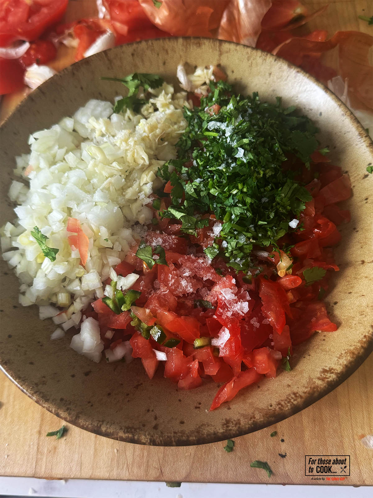 All of the ingredients for the pico de gallo in a mixing bowl.