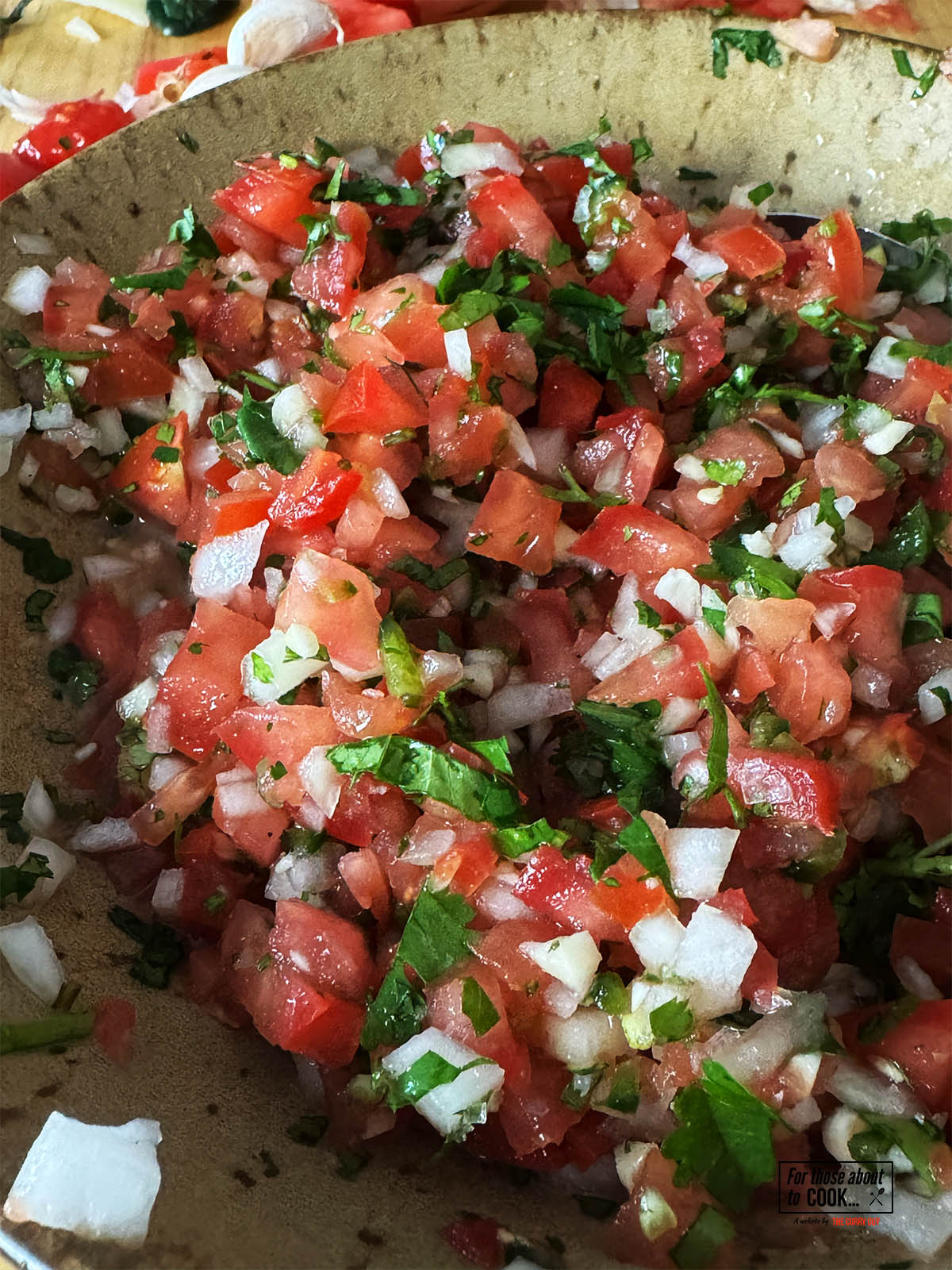 Stirring the ingredients together. Then adding salt and beer to taste.