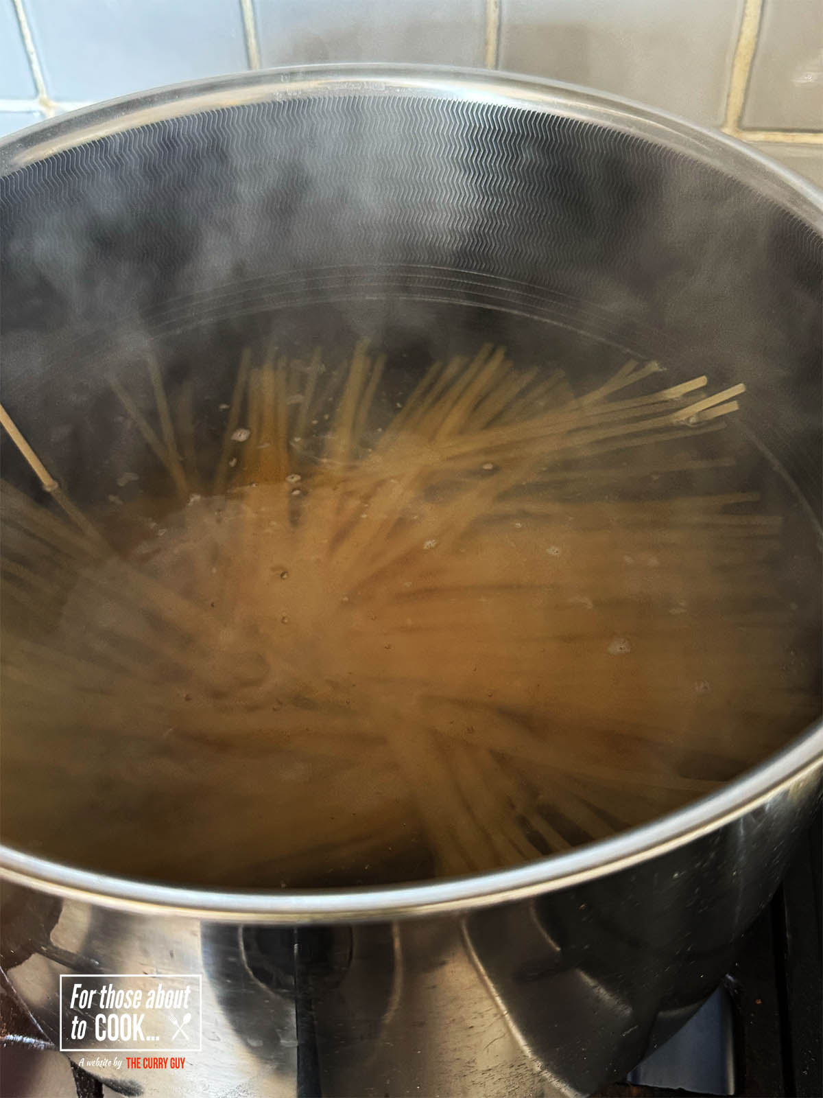 Cooking the linguini in a large pot of salted water.