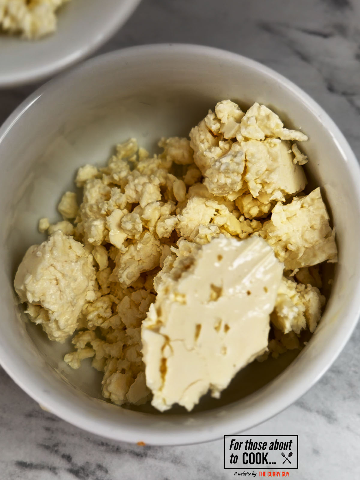 crumbled feta added to a bowl