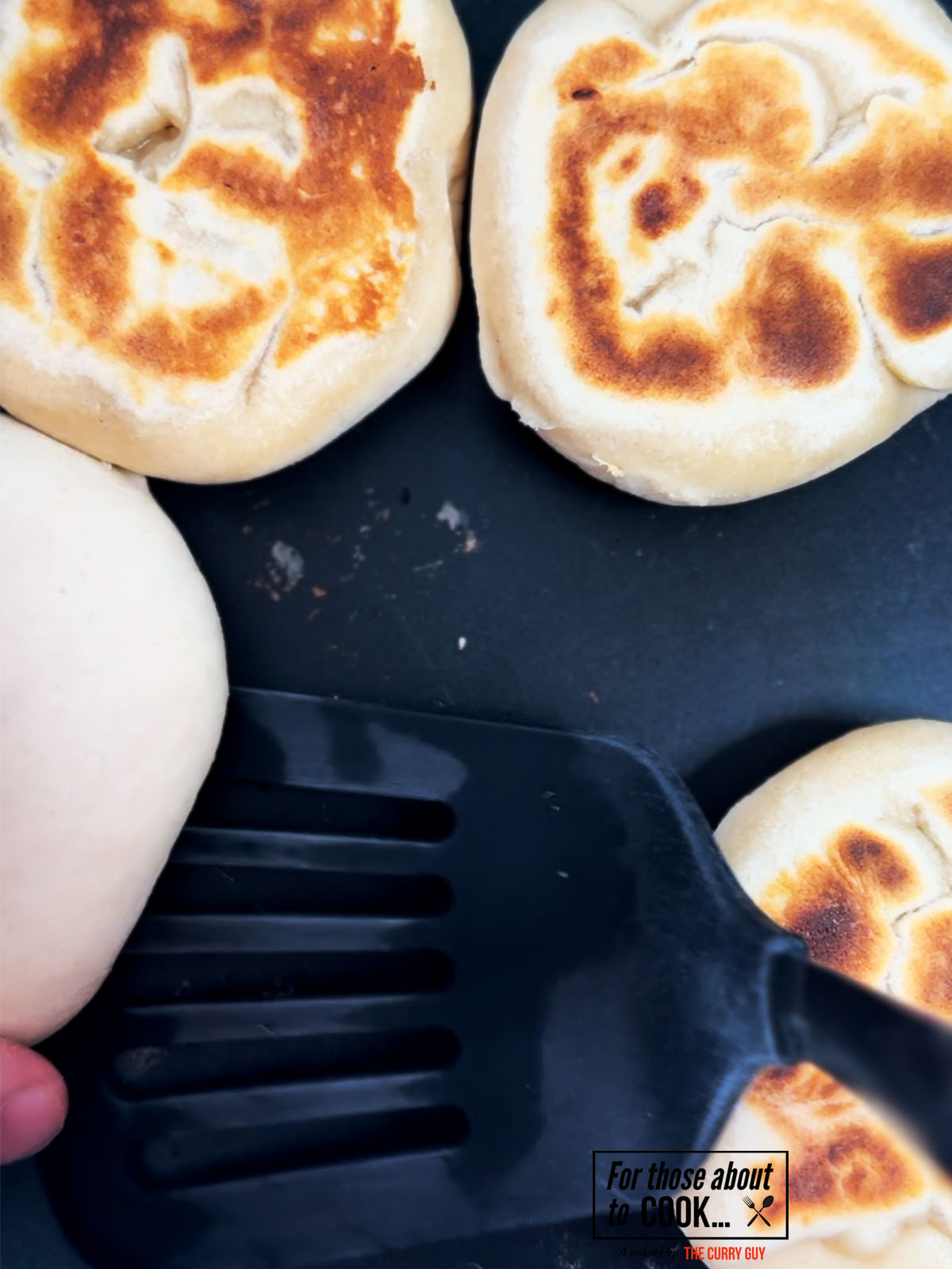 flatbreads frying in a pan