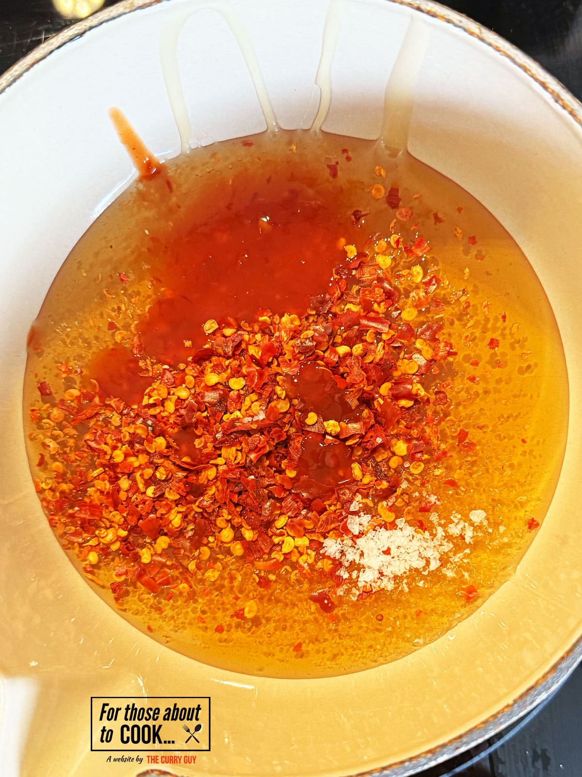 Spicy sauce added to the pan