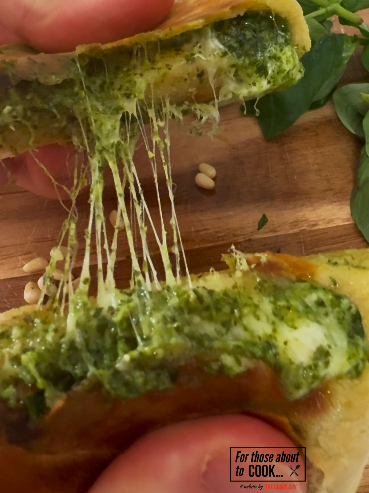Pesto and mozzarella stuffed flatbreads pulled apart