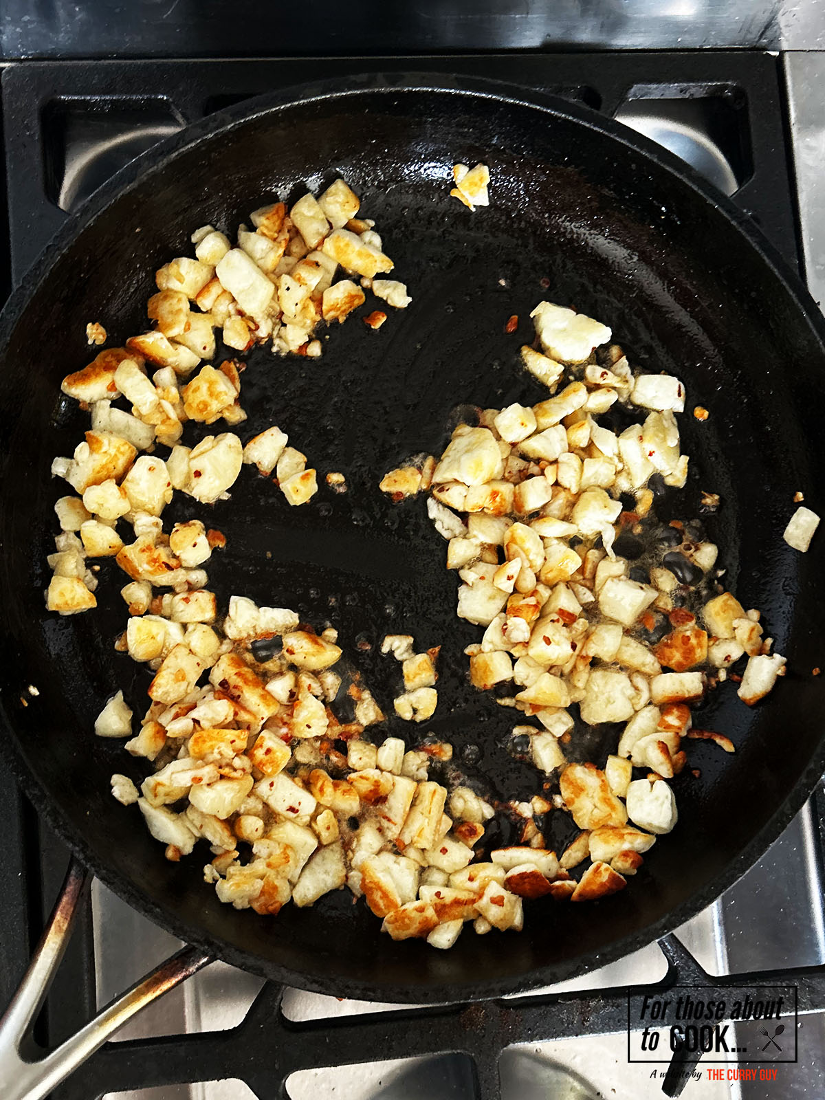 Halloumi frying in a pan