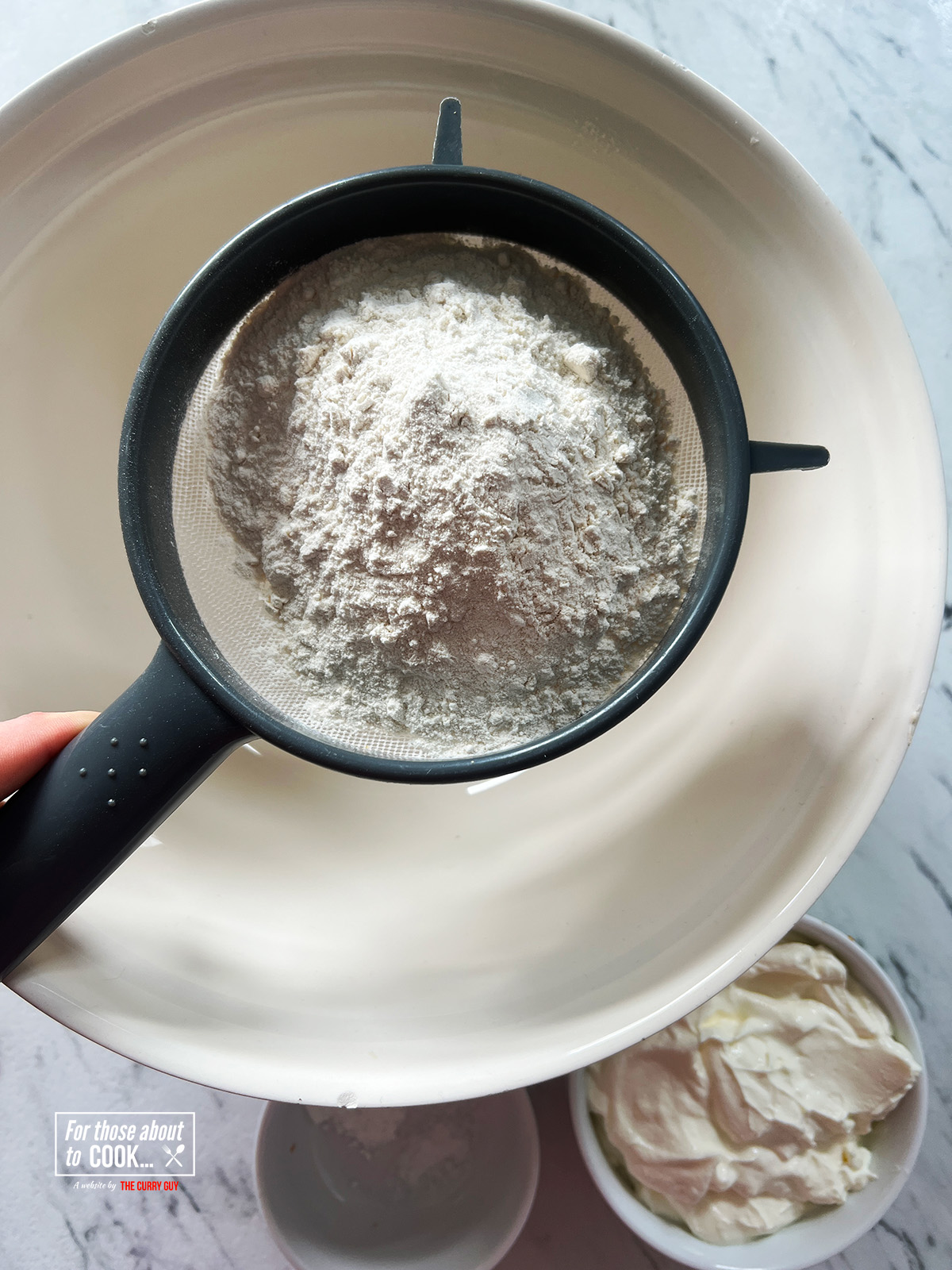 sieving the flour 

