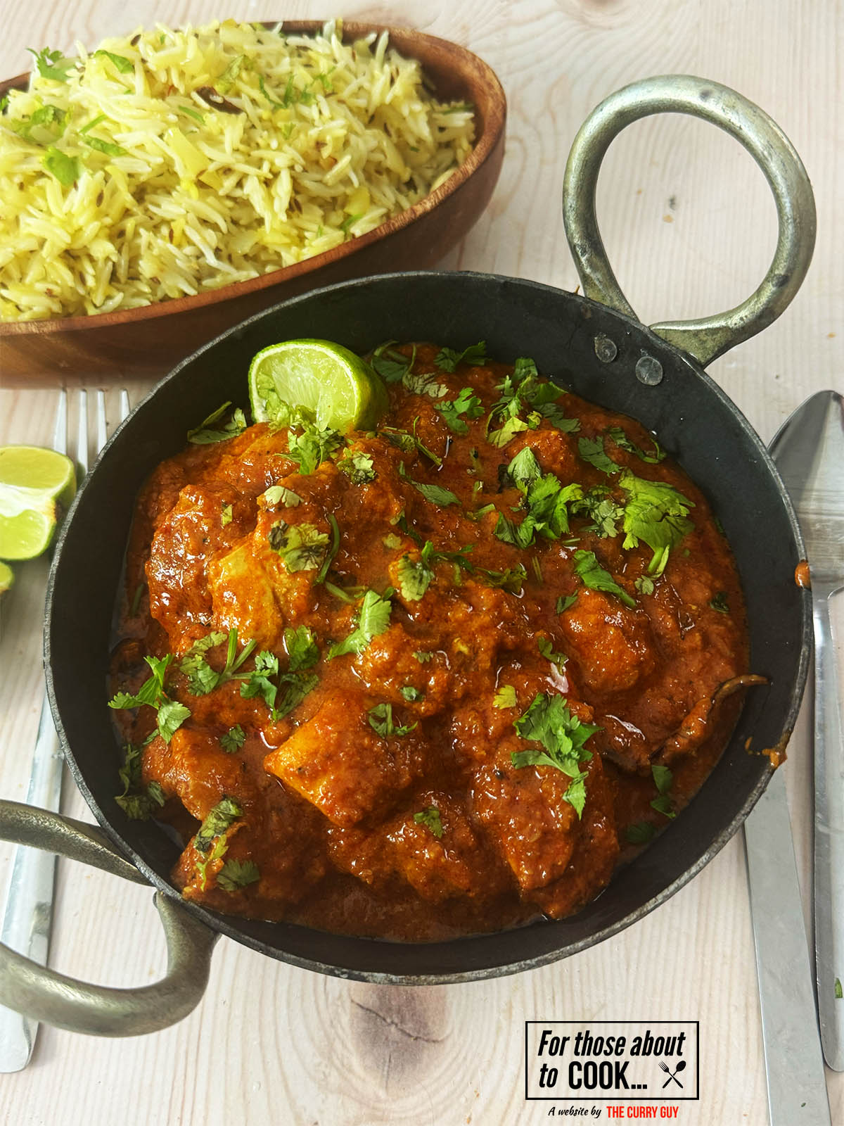 30 Minute Chicken Madras in a serving bowl next to rice.