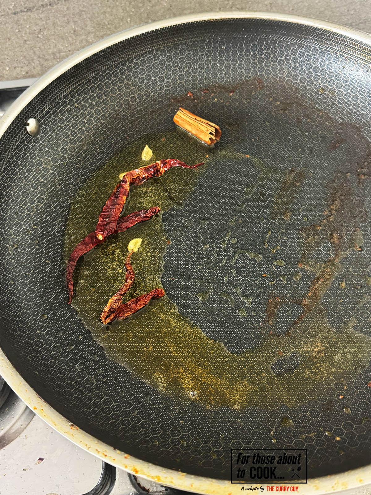 Infusing the whole spices in oil or ghee.
