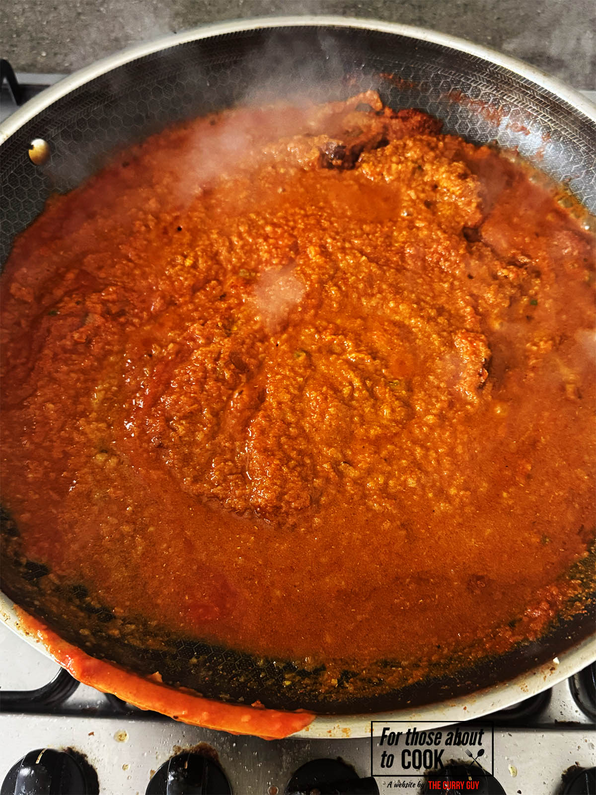Stirring in the Passata and stock.