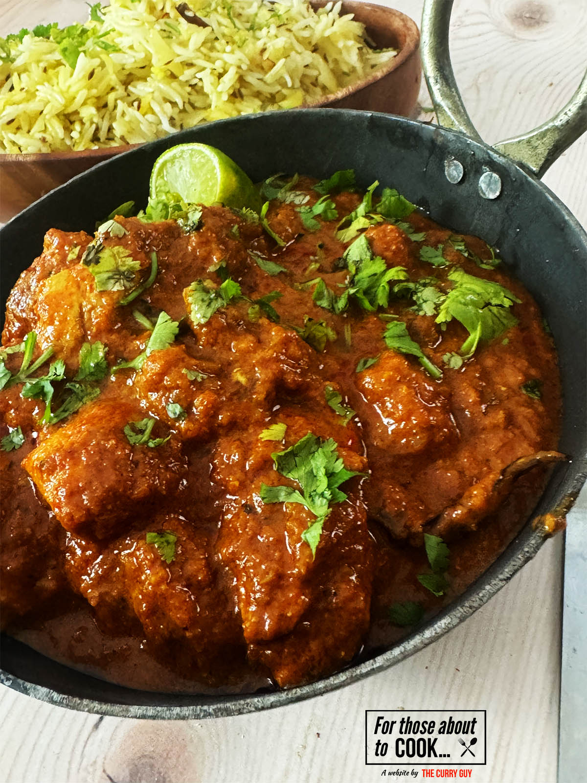 30 Minute Chicken Madras in a serving bowl next to pilau rice.