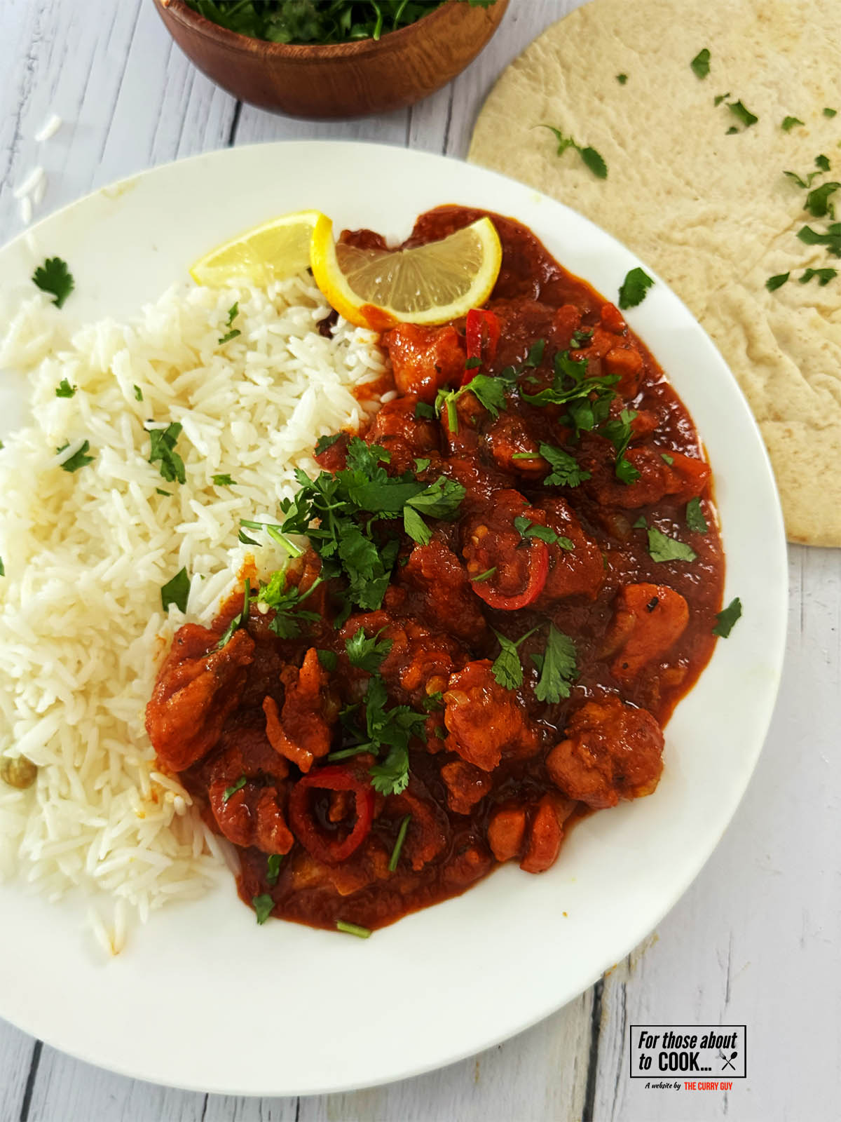 Chicken Pathia on a serving plate with rice.