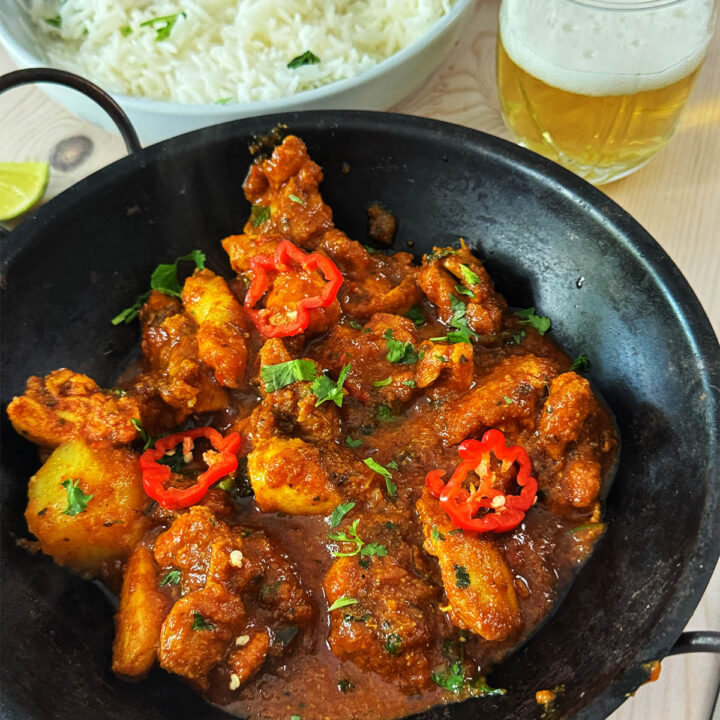 Chicken vindaloo curry in a serving dish.
