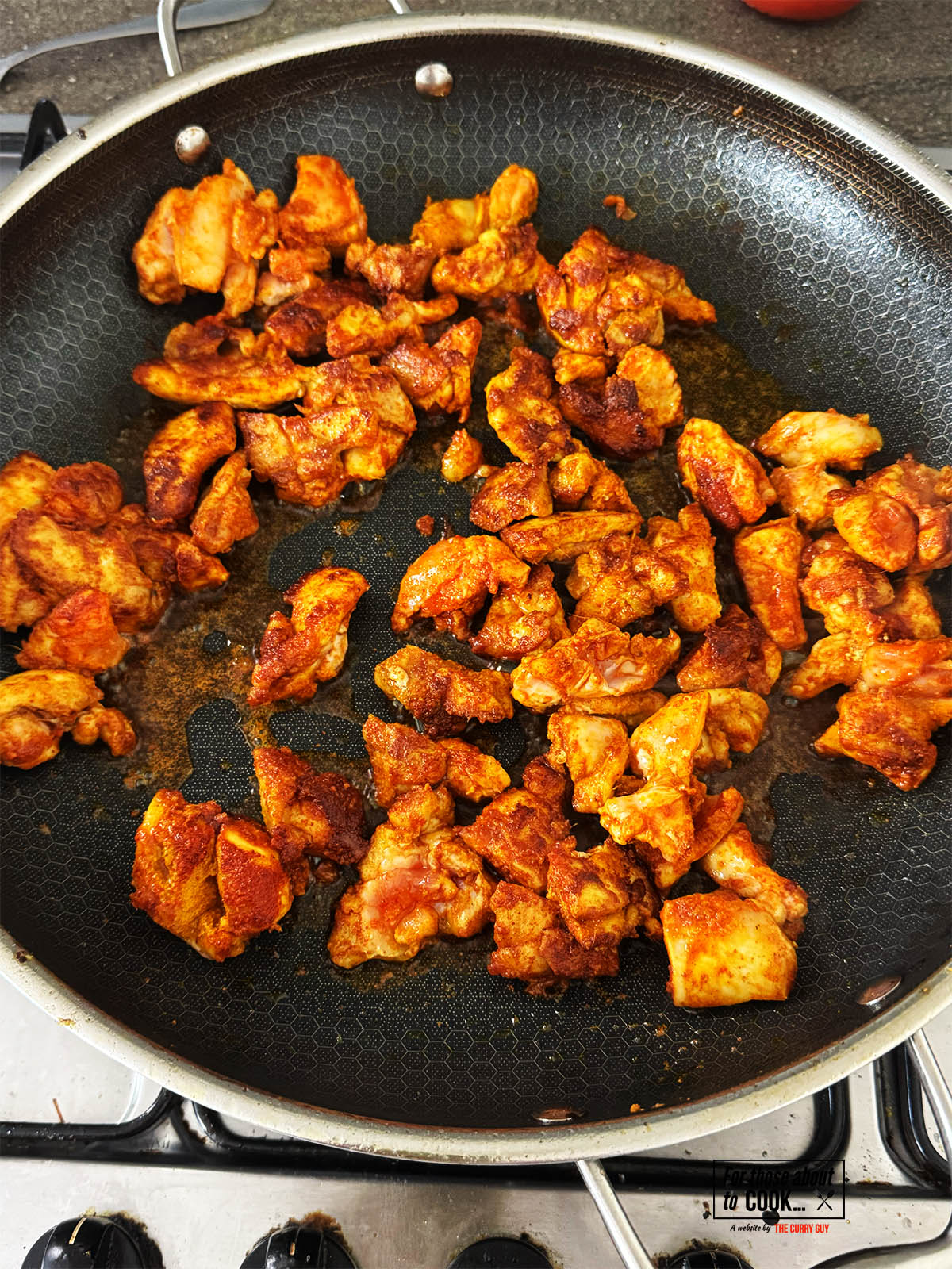 Frying the chicken.