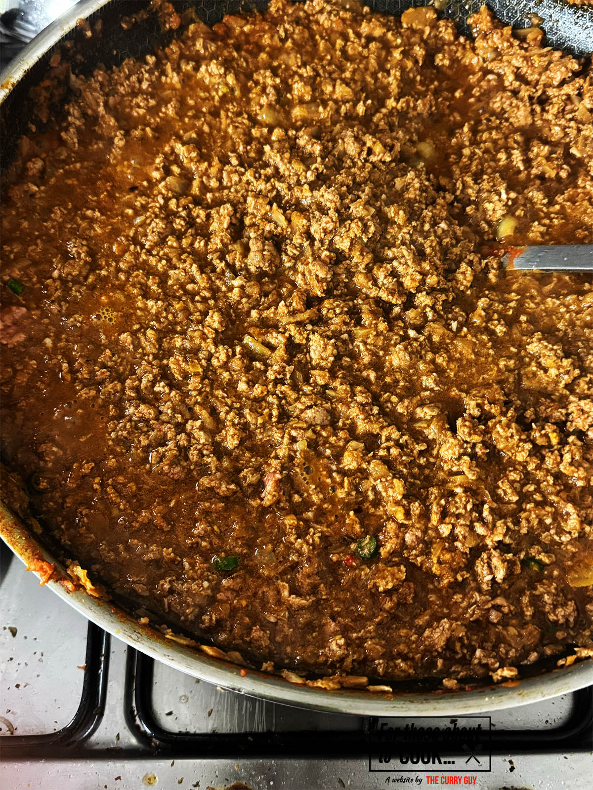 Letting the sauce cook down.