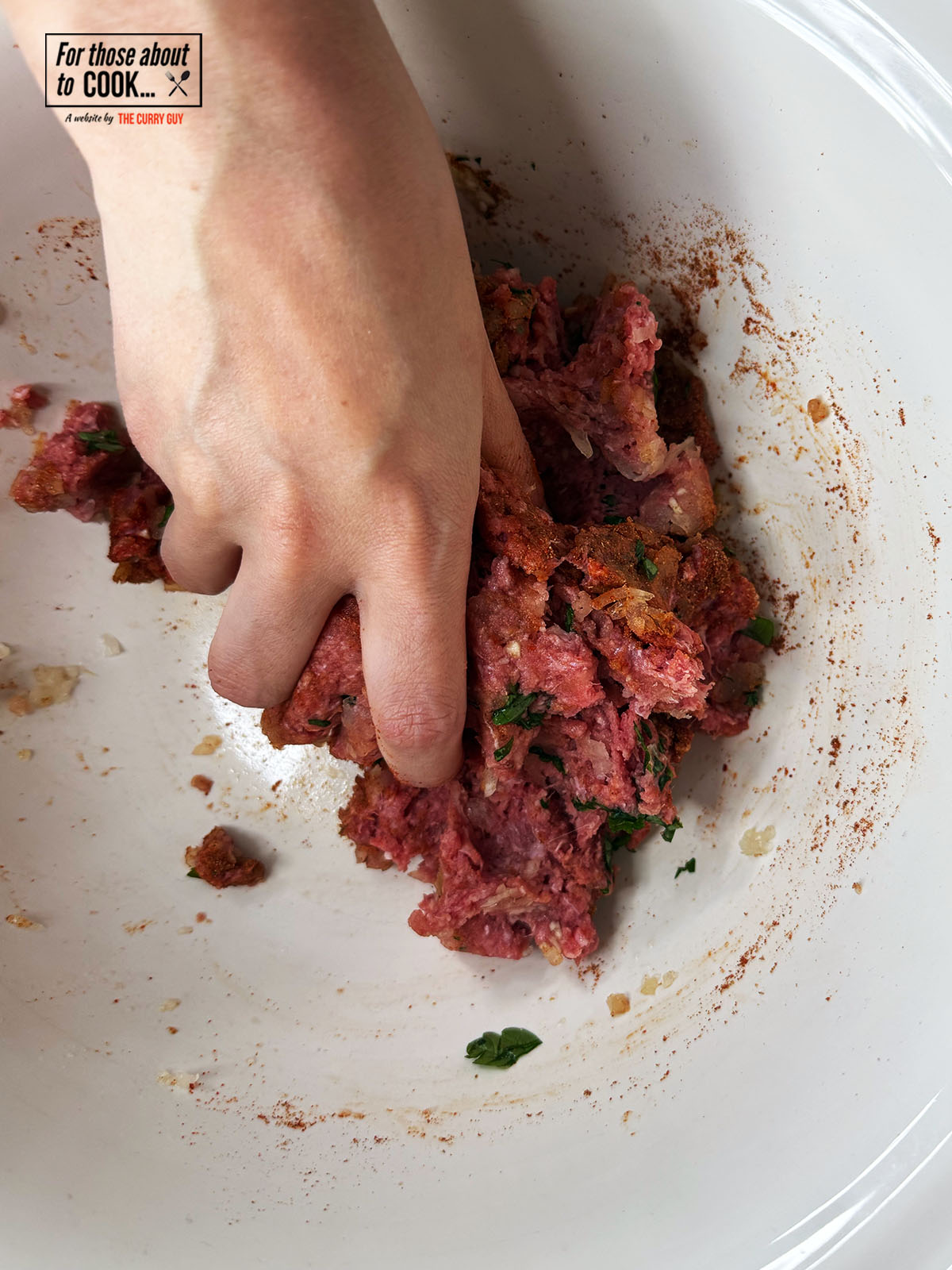 Mixing the meat mixture together in a bowl