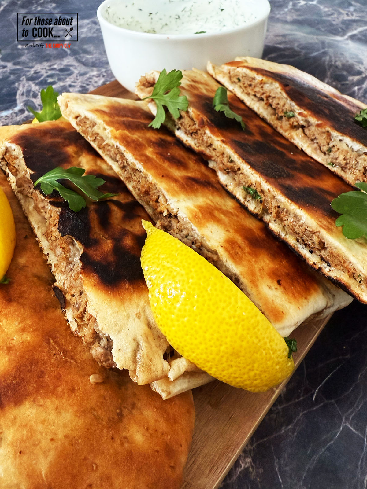 Arayes finished and garnished with parsley and lemon