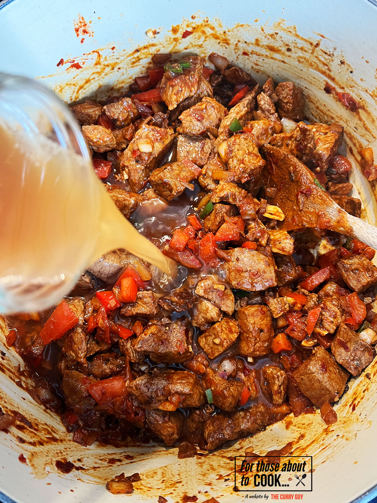 Beef broth added to the pan