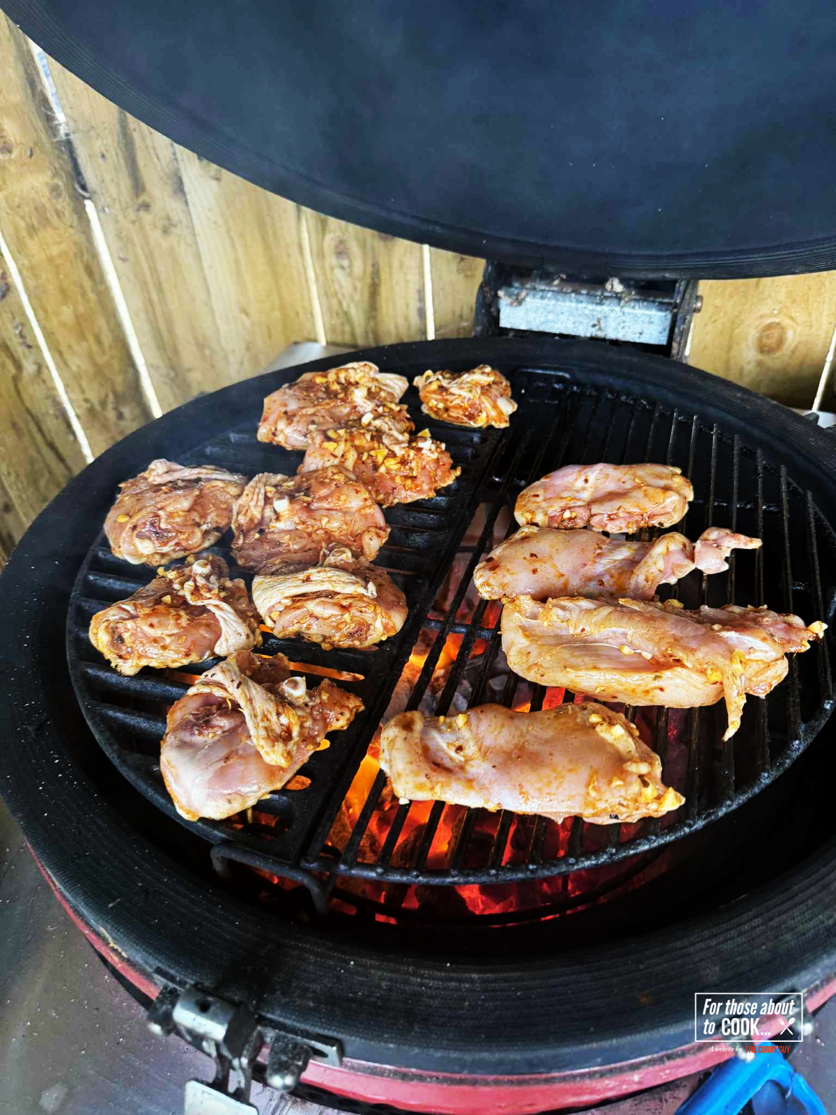 Heated grill top with chicken cooking 