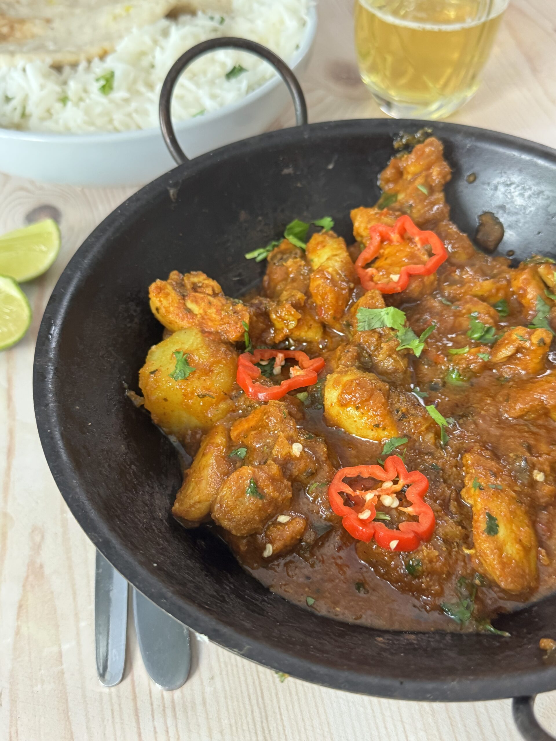 Chicken vindaloo in a serving bowl.
