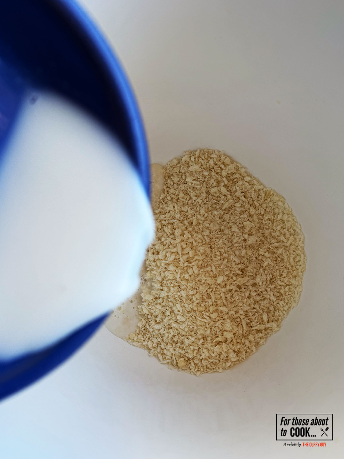 Breadcrumbs and milk in a bowl
