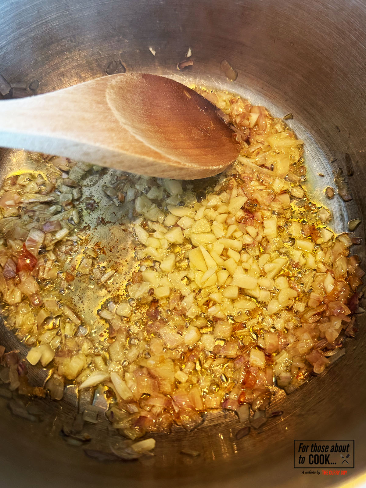 Onions and garlic browning in a pan