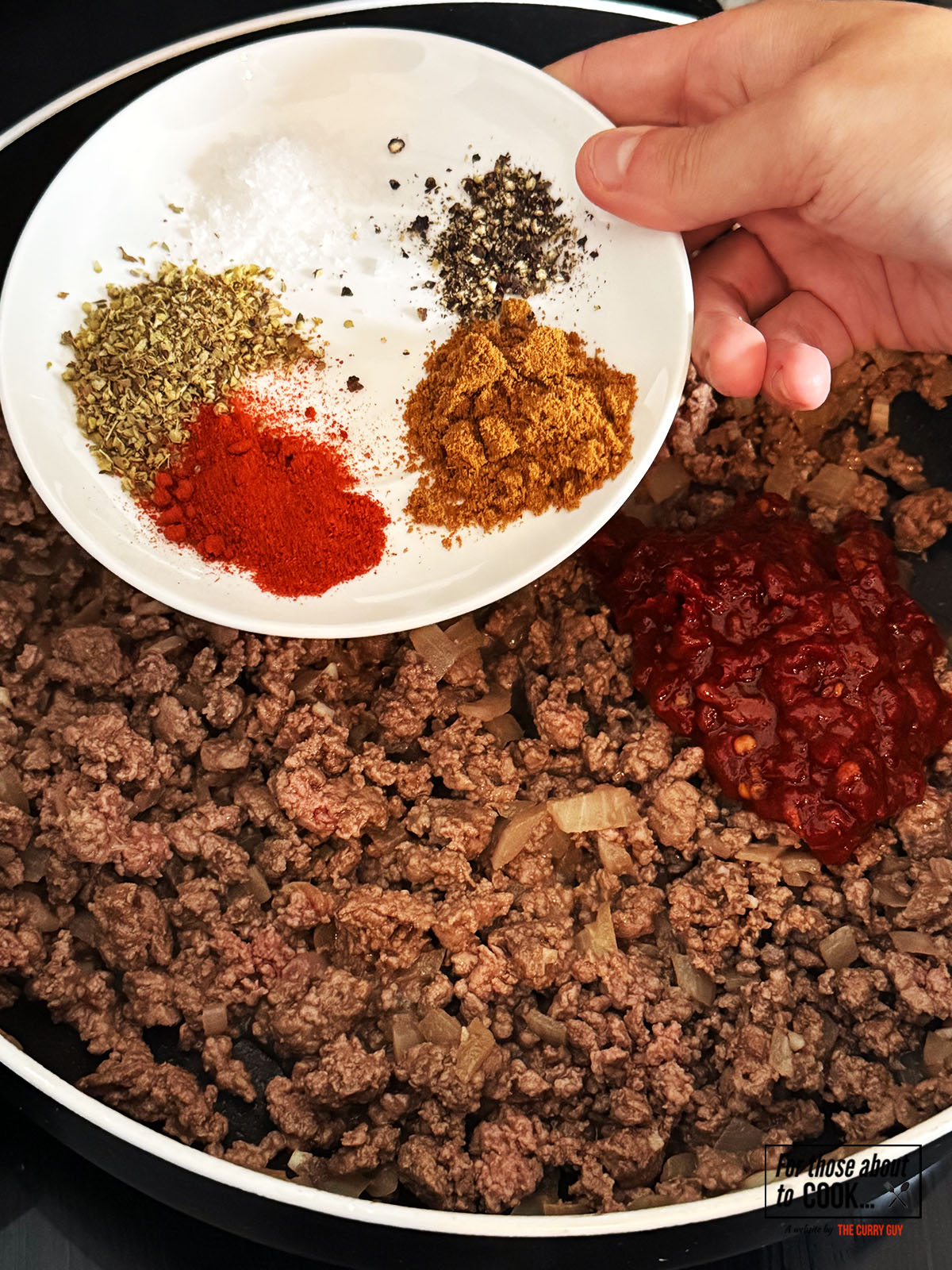 Blended chipotle chillies in adobo sauce and spices added to the pan