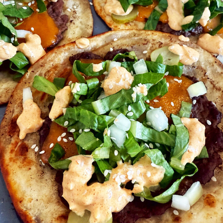 Cheeseburger tacos topped with big mac sauce