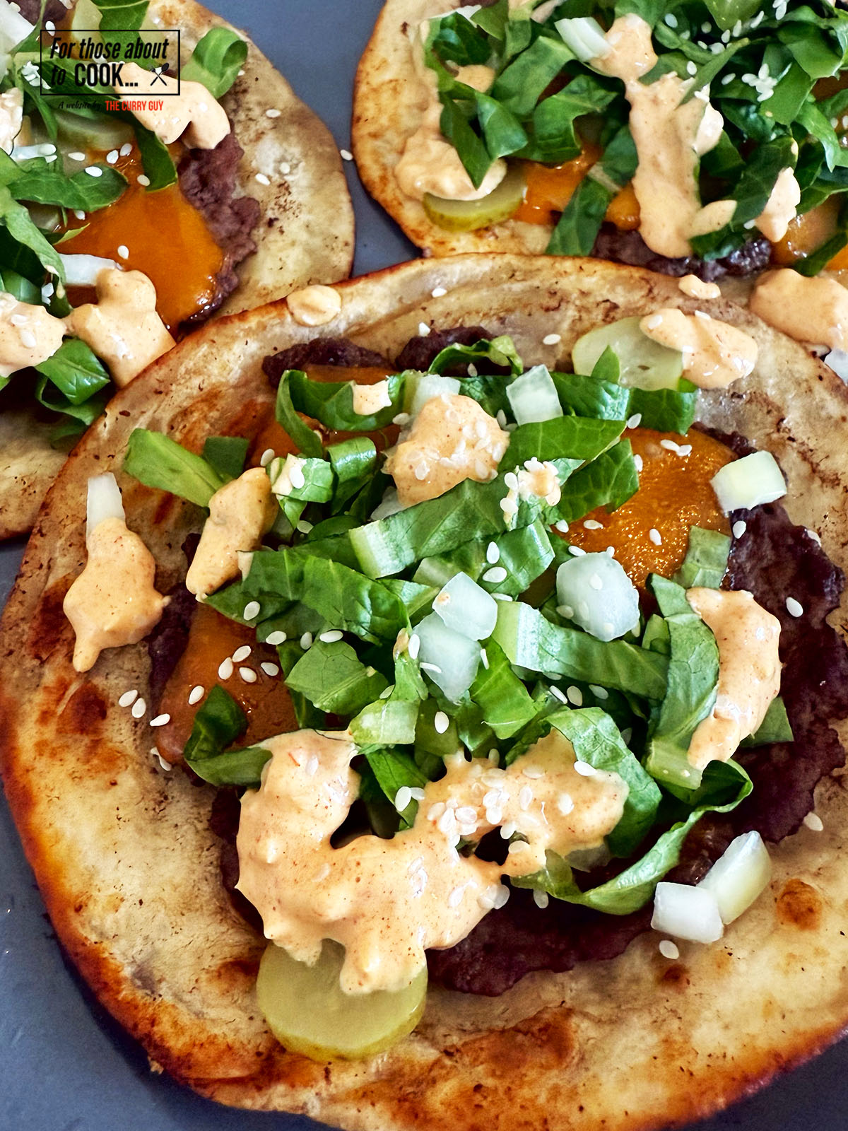 Cheeseburger tacos topped with big mac sauce