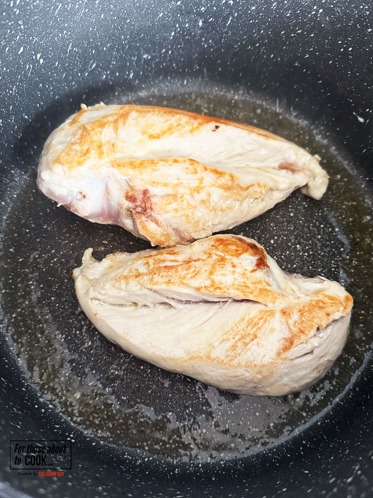 Chicken browning in a pan