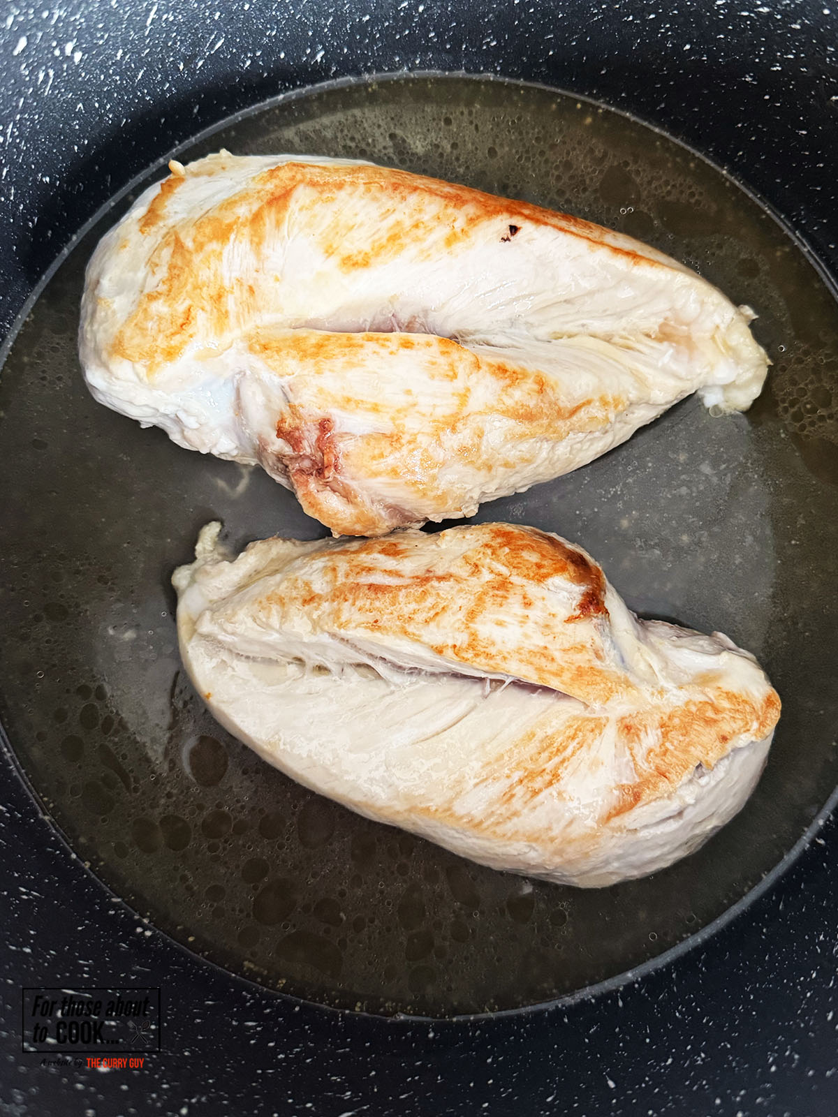 Chicken stock added to the pan