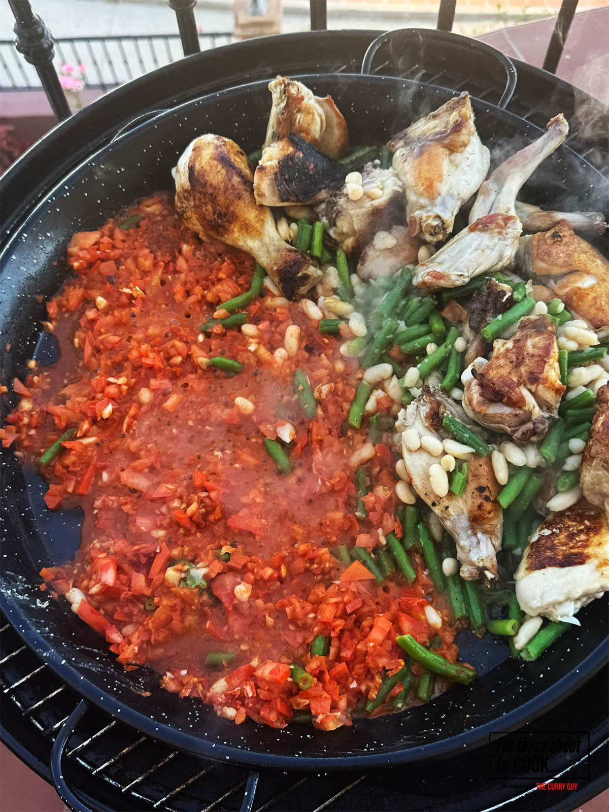 The tomatoes bubbling hot and breaking down.