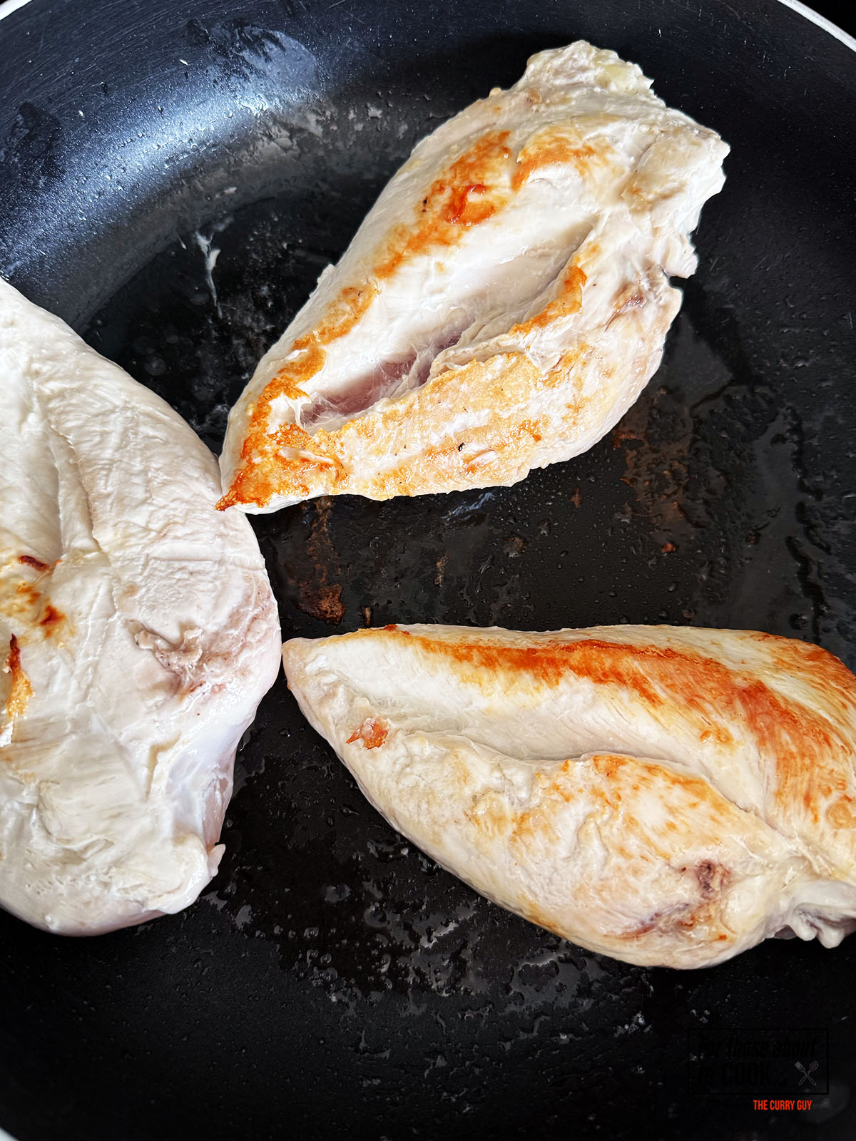 Chicken browning in a pan