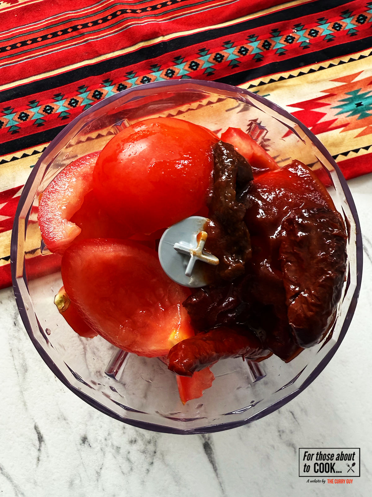 Tinga sauce ingredients in a food processor